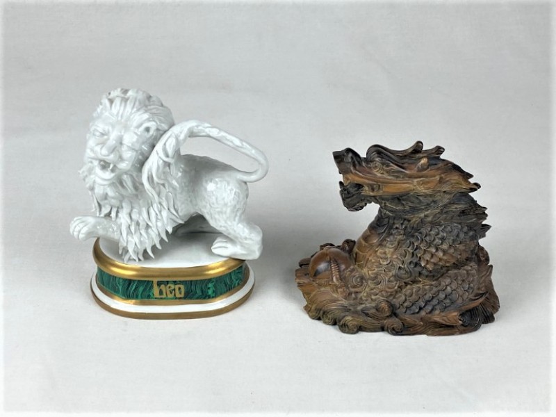 Twee beeldjes in Chinese stijl: een leeuw en een draak