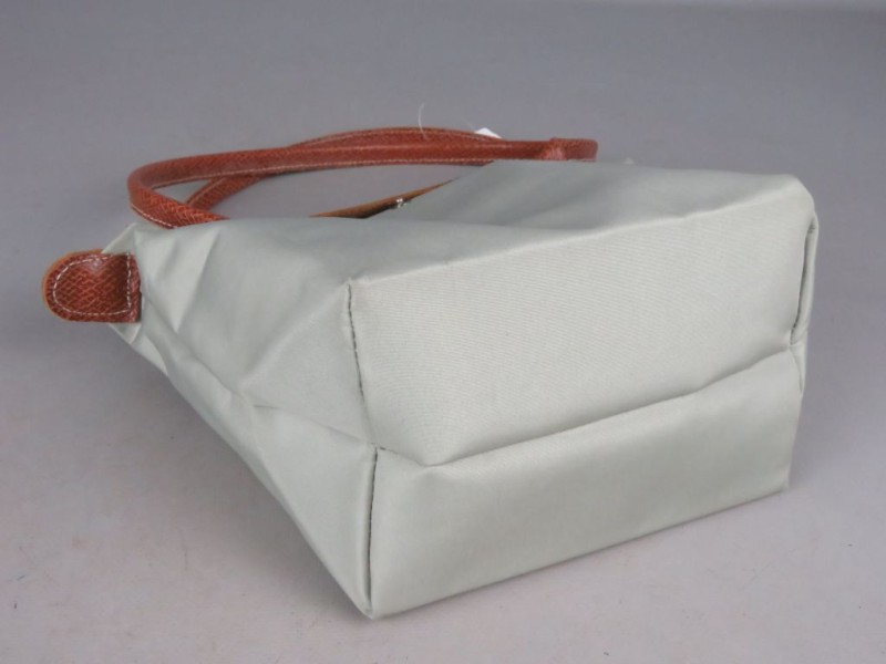 Kleine beige dameshandtas gemerkt Longchamp